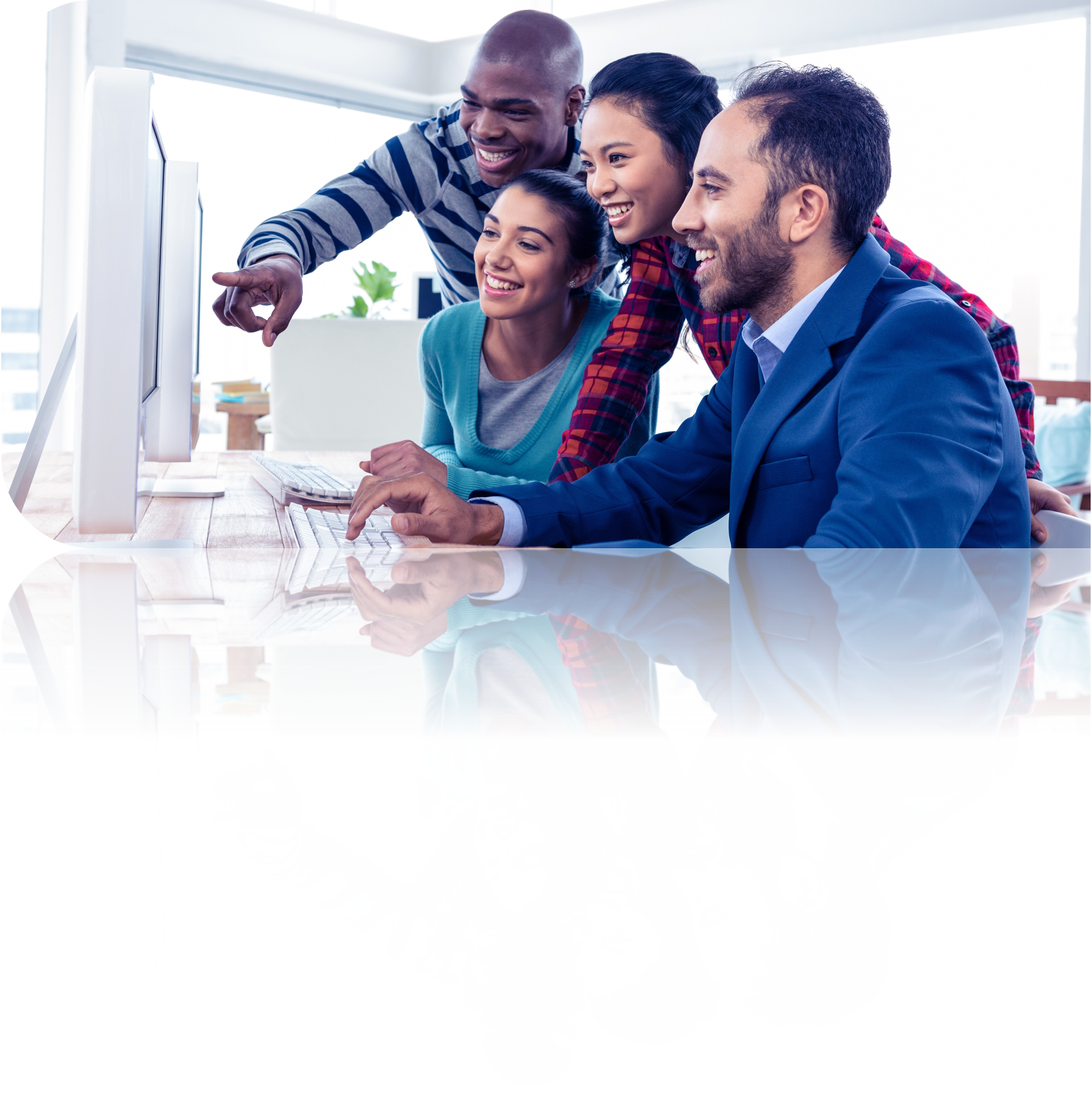 A group of people looking at a computer monitor together